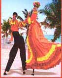 Salsa dancing stilt walkers