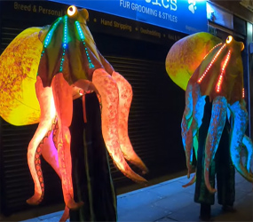 OCEAN THEMED ENTERTAINMENT - LED OCTOPUS STILTS TO HIRE