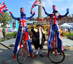 union jack -best british stilt walkers-tall bike performers uk hire